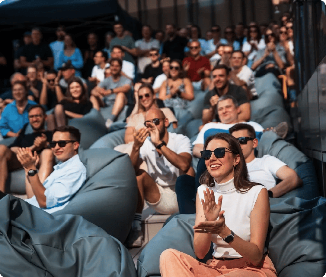 Employees applauding outside at Decodo