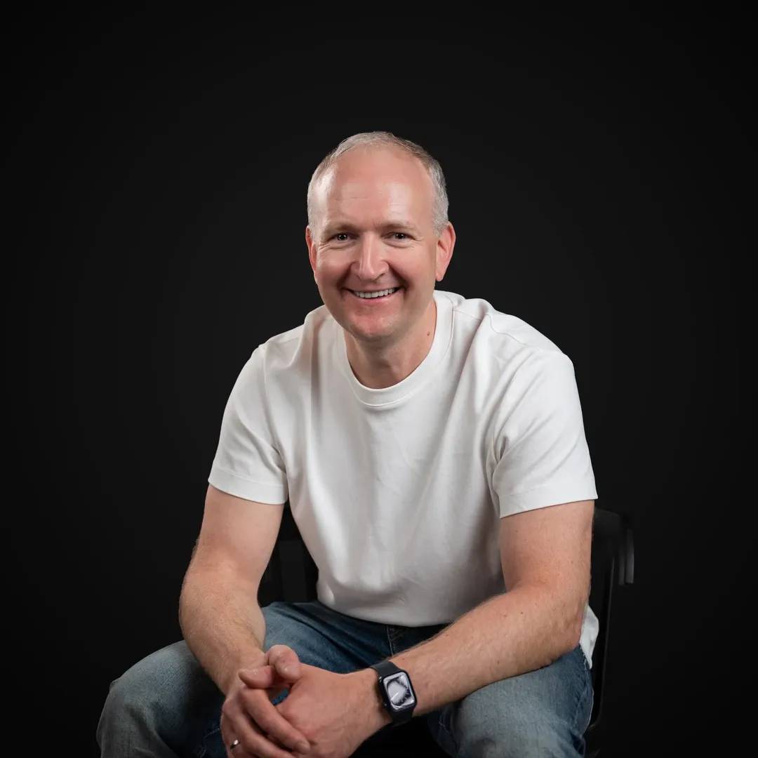 Professional photo of the Decodo's Head of Product smiling at the camera.