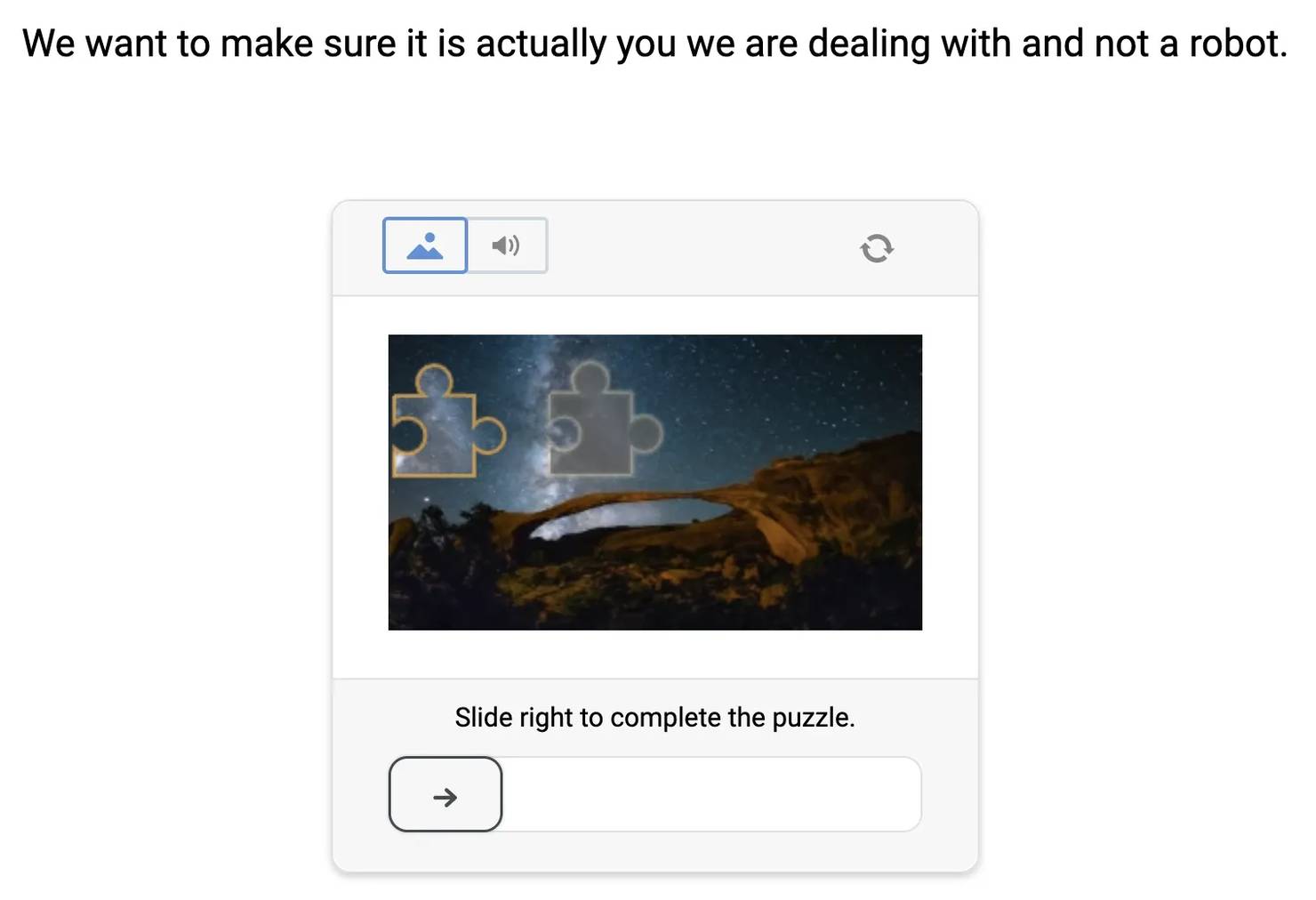 CAPTCHA verification showing a nature scene with a starry night sky and a slider control prompting the user to slide right to complete the image puzzle.
