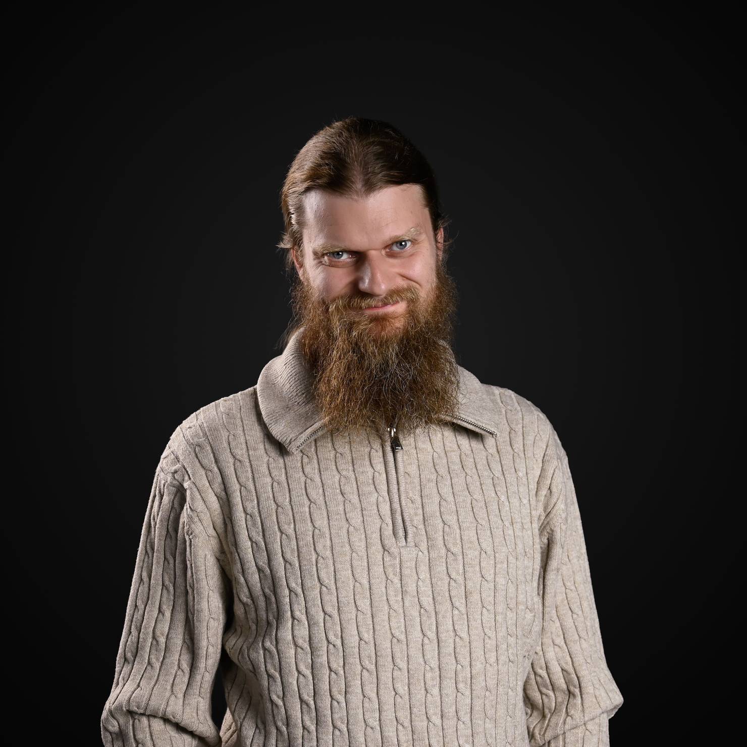 Professional photo of the Decodo's Director of Engineering smiling at the camera.