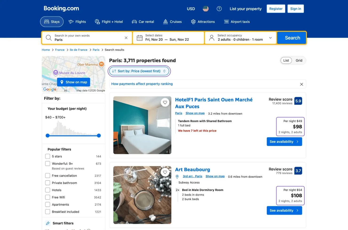 Booking.com search window showing Paris as the destination, November 20–22 as the dates, and 1 room for two adults.