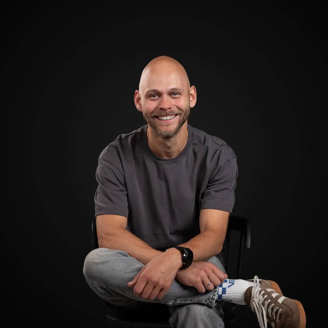 Professional photo of the Decodo's Head of Marketing smiling at the camera.