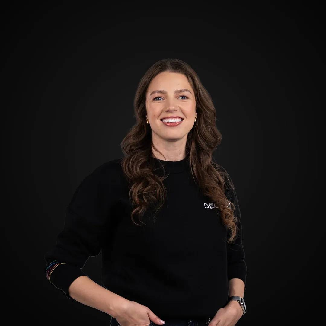 Professional photo of the Decodo's Chief of Staff smiling at the camera.