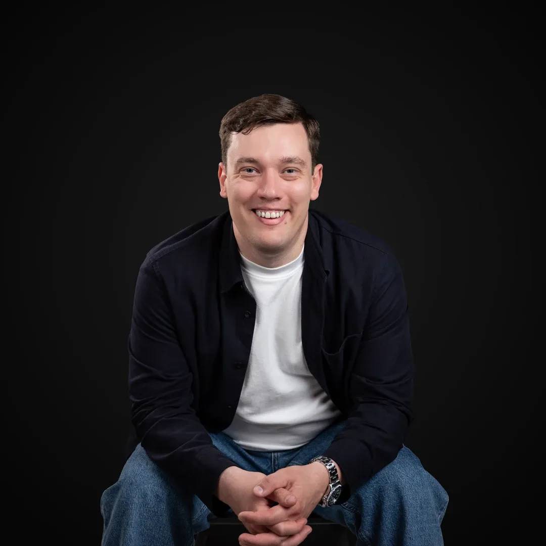 Professional photo of the Decodo's CEO smiling at the camera.